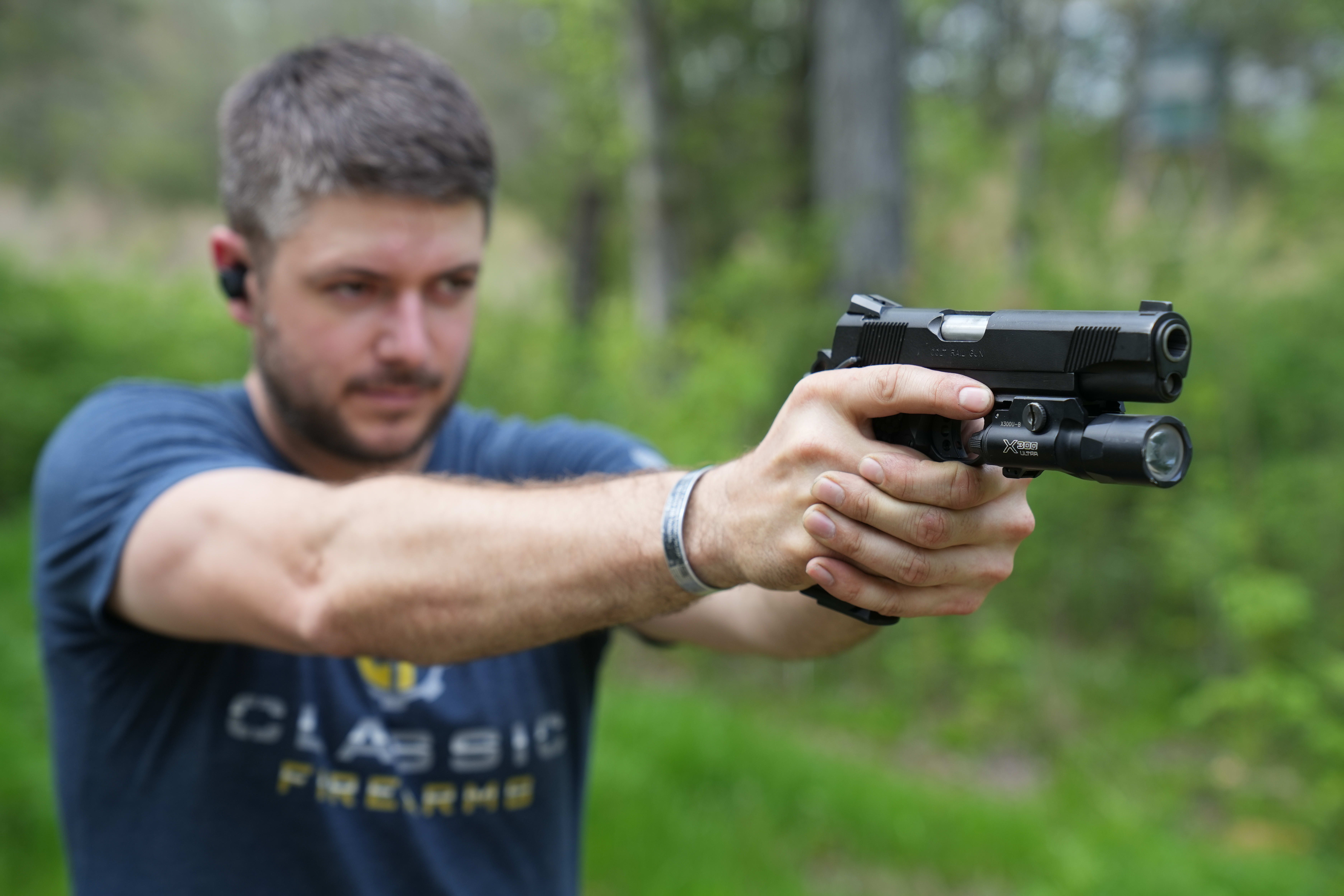 Clint preparing to fire his 1911 pistol