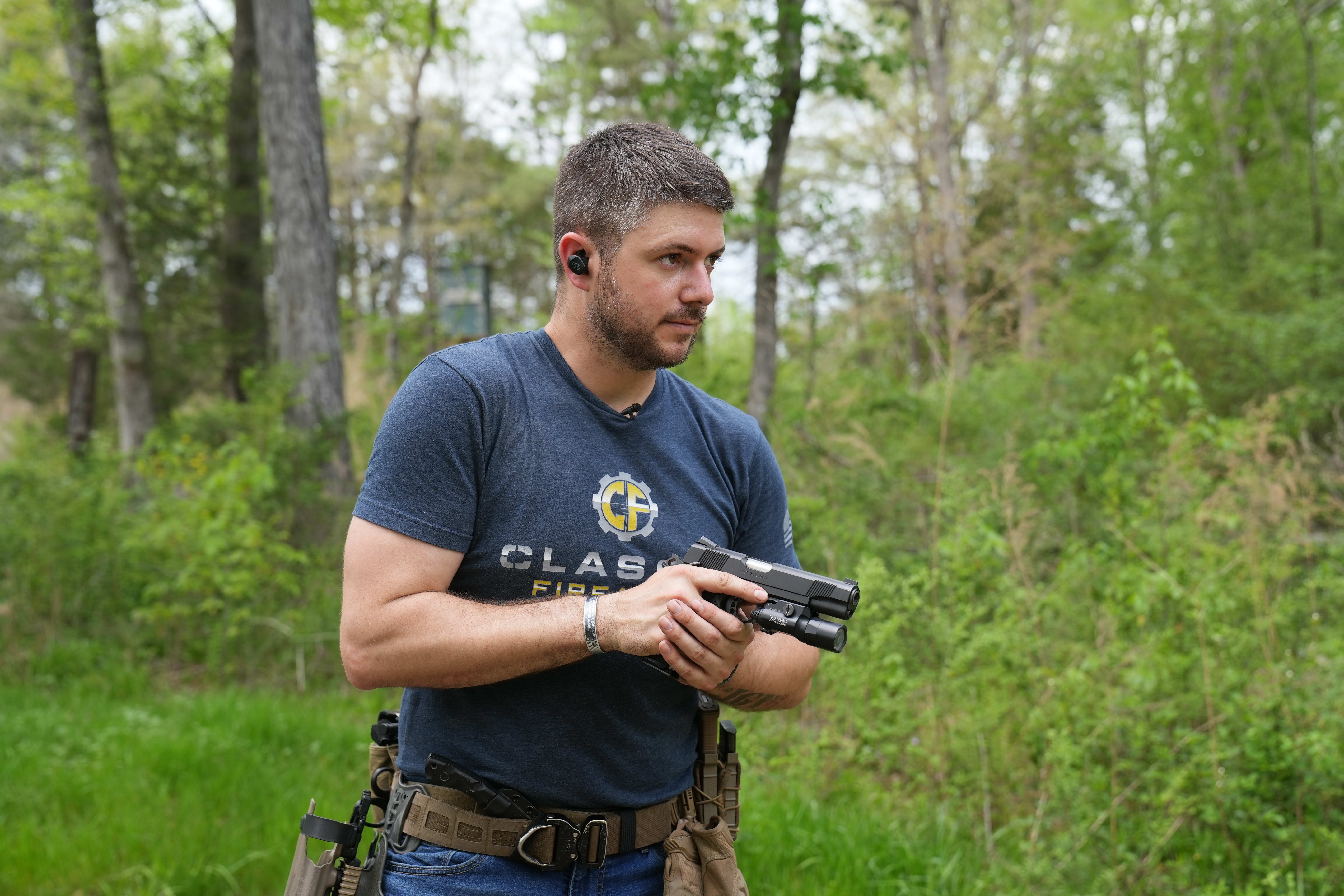 Clint holds his 1911 with TLR-1 Light at the ready