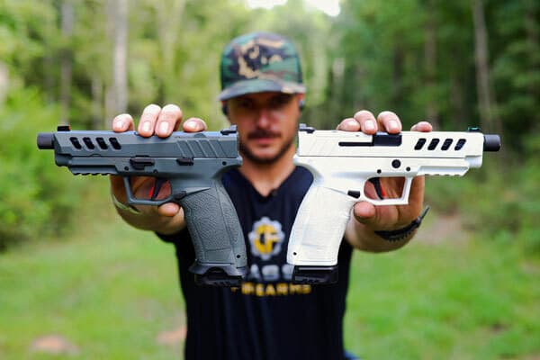 Clint holding up the Tisas PX-9 Gen 3 Special Edition in Space White & Night Stalker Gray